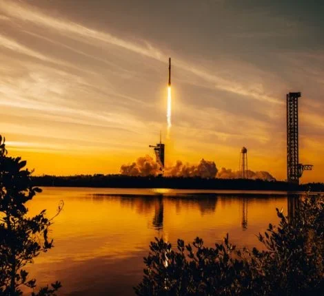 space (1) A space rocket taking off in front of a sunset.
